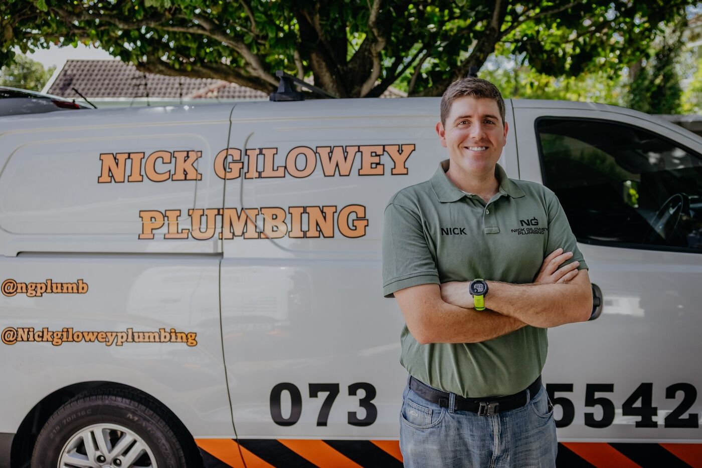 Nick Gilowey standing beside his van